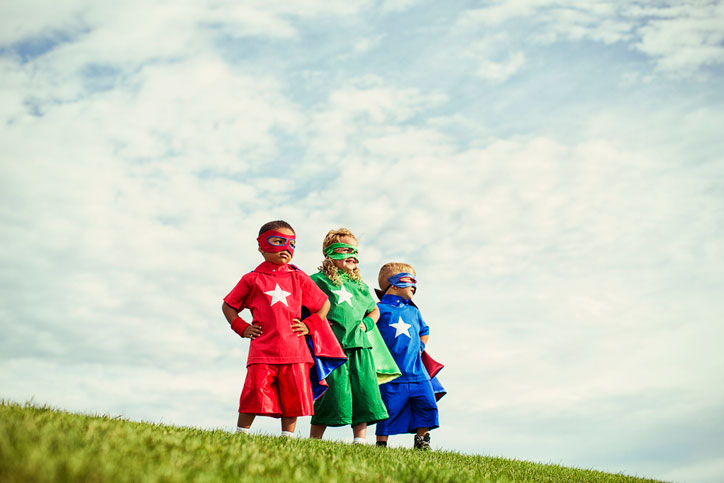 little super heroes on hillside